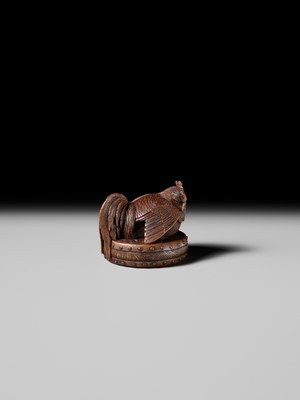 Lot 187 - MASATAMI: A WOOD NETSUKE OF A COCKEREL ON A WAR DRUM