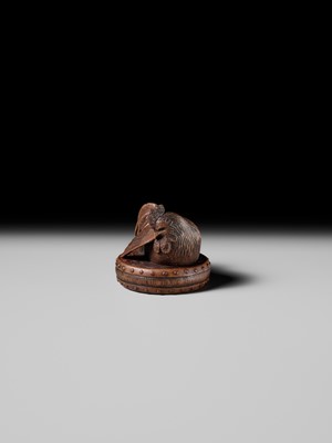 Lot 187 - MASATAMI: A WOOD NETSUKE OF A COCKEREL ON A WAR DRUM