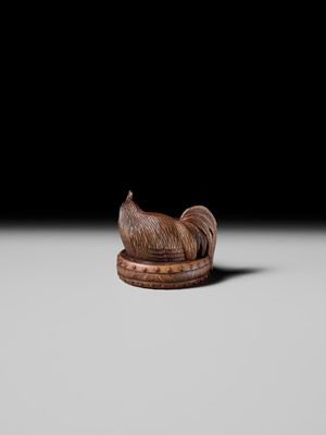 Lot 187 - MASATAMI: A WOOD NETSUKE OF A COCKEREL ON A WAR DRUM