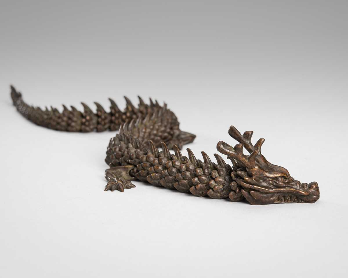 Lot 49 - A BRONZE JIZAI OKIMONO OF A DRAGON