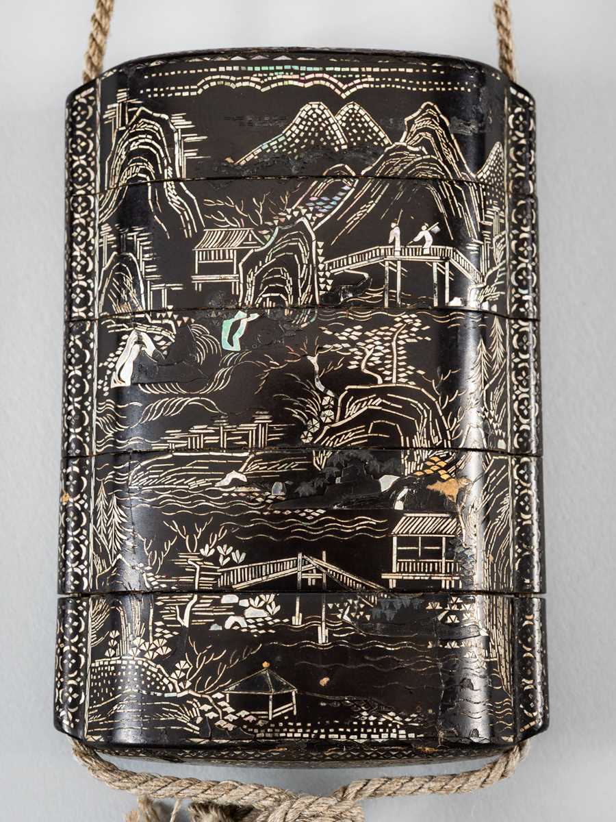 Lot 1420 - A FOUR-CASE MOTHER OF PEARL INLAID LACQUER INRO DEPICTING A LANDSCAPE