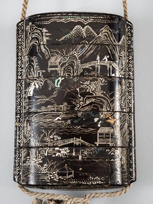Lot 1420 - A FOUR-CASE MOTHER OF PEARL INLAID LACQUER INRO DEPICTING A LANDSCAPE