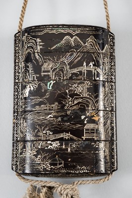 Lot 1420 - A FOUR-CASE MOTHER OF PEARL INLAID LACQUER INRO DEPICTING A LANDSCAPE