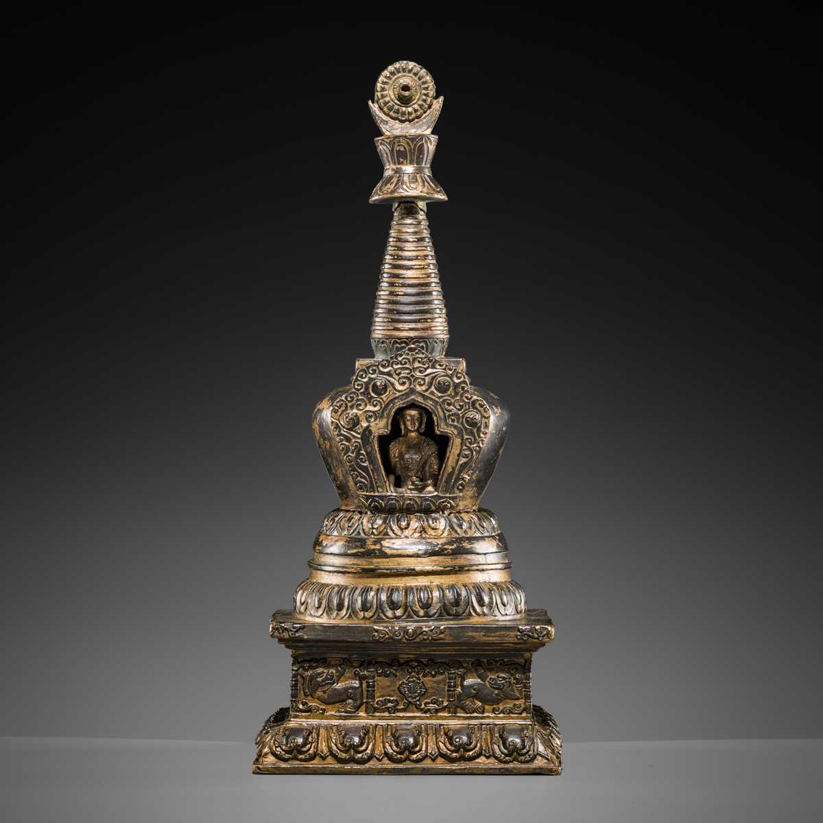 Lot 32 - A LARGE GILT-BRONZE STUPA CONTAINING A FIGURE OF BUDDHA SHAKYAMUNI, TIBET, LATE 19TH TO FIRST HALF OF THE 20TH CENTURY