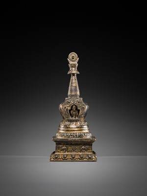 Lot 32 - A LARGE GILT-BRONZE STUPA CONTAINING A FIGURE OF BUDDHA SHAKYAMUNI, TIBET, LATE 19TH TO FIRST HALF OF THE 20TH CENTURY