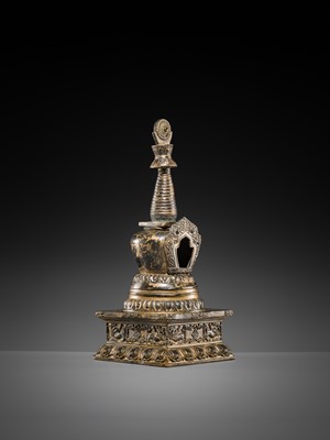 Lot 32 - A LARGE GILT-BRONZE STUPA CONTAINING A FIGURE OF BUDDHA SHAKYAMUNI, TIBET, LATE 19TH TO FIRST HALF OF THE 20TH CENTURY