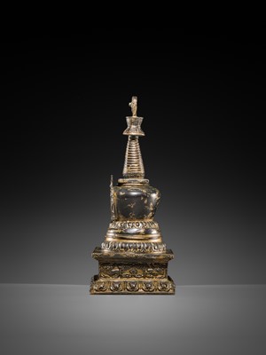 Lot 32 - A LARGE GILT-BRONZE STUPA CONTAINING A FIGURE OF BUDDHA SHAKYAMUNI, TIBET, LATE 19TH TO FIRST HALF OF THE 20TH CENTURY