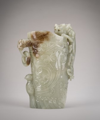 Lot 843 - A CELADON AND RUSSET JADE ARCHAISTIC VESSEL