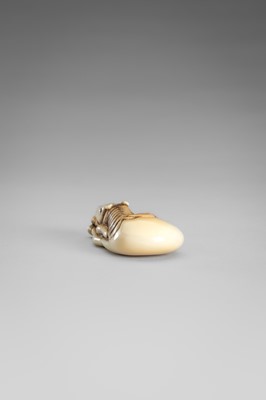 Lot 499 - AN IVORY NETSUKE OF A GRAZING HORSE