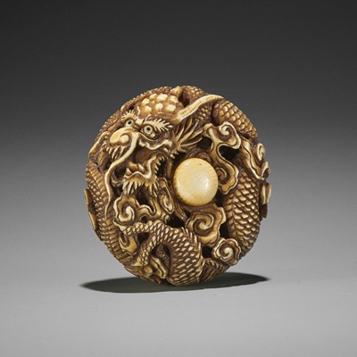 Lot 1574 - AN IVORY RYUSA MANJU NETSUKE OF A DRAGON WITHIN CLOUDS
