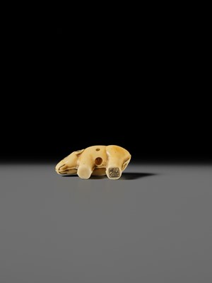 Lot 159 - OHARA MITSUSADA: AN IVORY NETSUKE OF AN OX-FORM OMAMORI