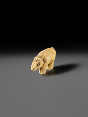 Lot 159 - OHARA MITSUSADA: AN IVORY NETSUKE OF AN OX-FORM OMAMORI