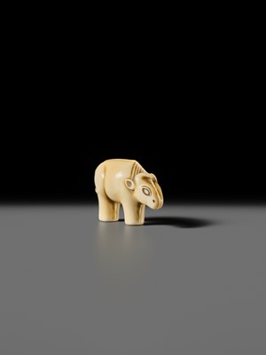 Lot 159 - OHARA MITSUSADA: AN IVORY NETSUKE OF AN OX-FORM OMAMORI