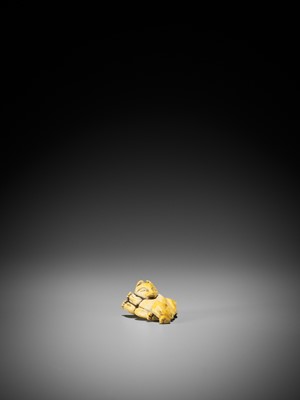 Lot 1491 - AN IVORY NETSUKE OF A DANCING KITSUNE
