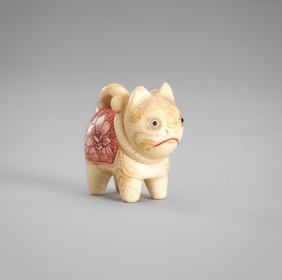 Lot 1564 - A CHARMING MINIATURE IVORY NETSUKE OF INU HARIKO
