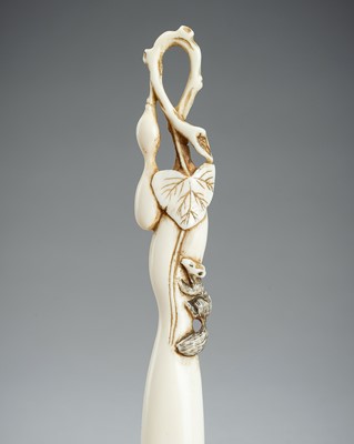 Lot 1641 - A LARGE IVORY SASHI NETSUKE OF A DORMOUSE ON A GOURD, MEIJI