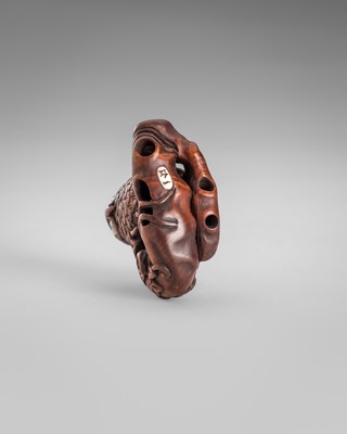 Lot 374 - IKKYU: A WOOD NETSUKE OF AN OWL WITH A MOVABLE OWLET