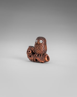 Lot 374 - IKKYU: A WOOD NETSUKE OF AN OWL WITH A MOVABLE OWLET