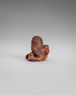 Lot 374 - IKKYU: A WOOD NETSUKE OF AN OWL WITH A MOVABLE OWLET