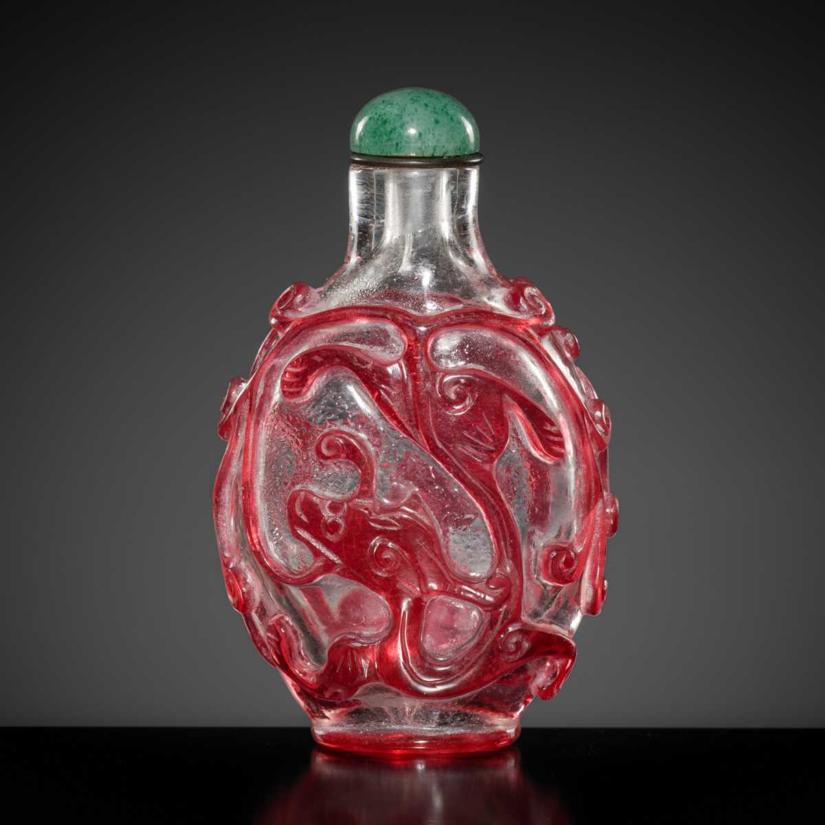 Lot 465 - A RUBY-RED OVERLAY ON TRANSPARENT GLASS ‘CHILONG’ SNUFF BOTTLE, 1740-1840