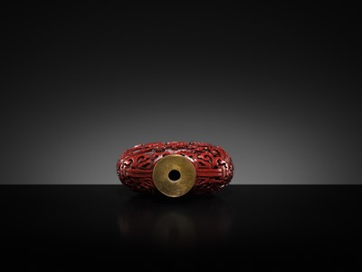 Lot 469 - A CINNABAR LACQUER ‘COURT LADIES’ SNUFF BOTTLE, 19TH CENTURY