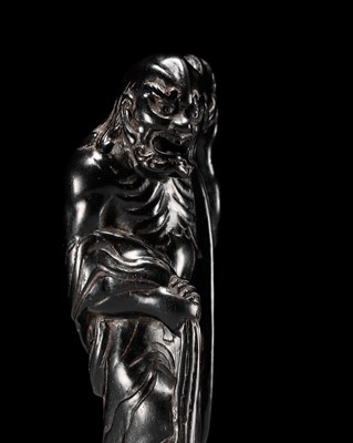 Lot 232 - RYURAKU: A TALL AND IMPRESSIVE EBONY WOOD NETSUKE OF AN IMMORTAL