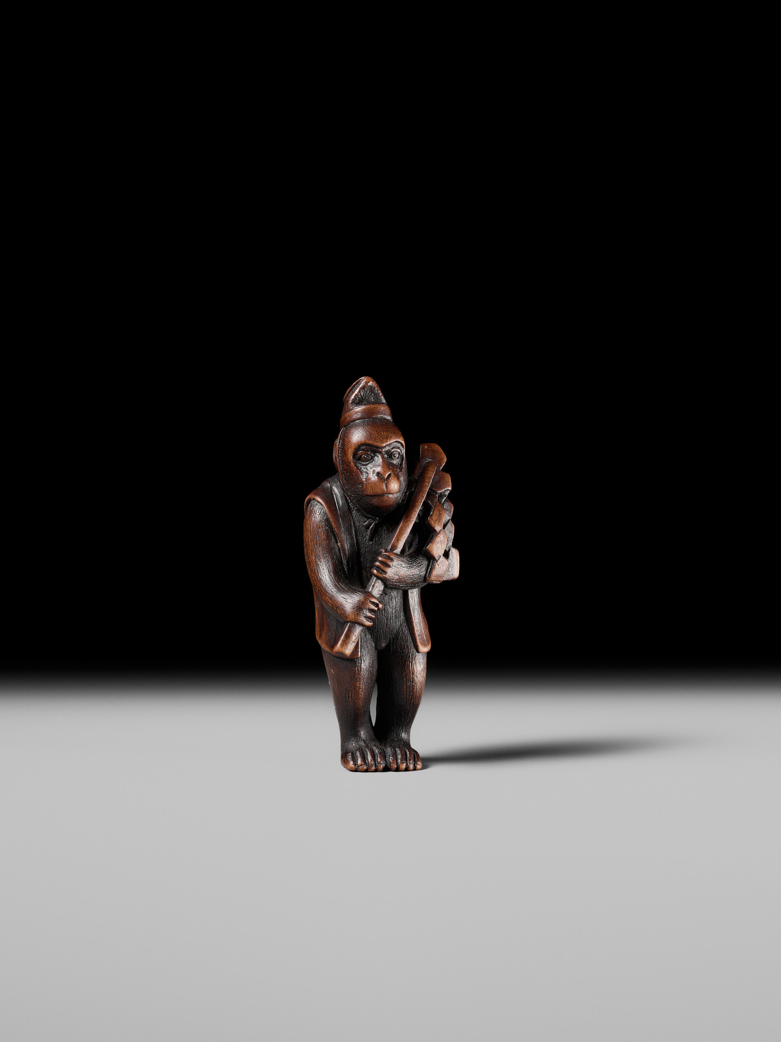 Lot 211 - KANO TOMOKAZU: A FINE WOOD NETSUKE OF A