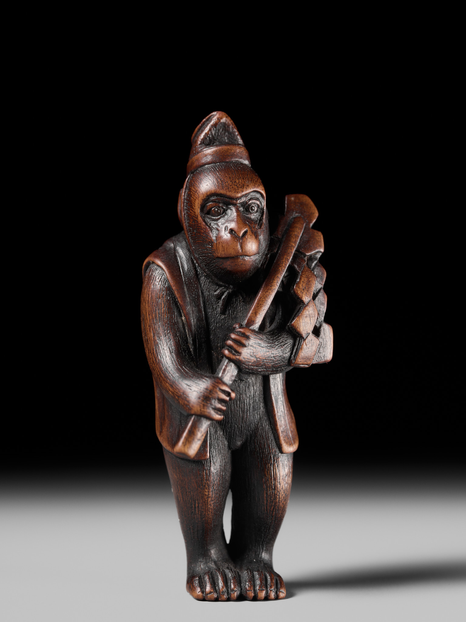 Lot 211 - KANO TOMOKAZU: A FINE WOOD NETSUKE OF A