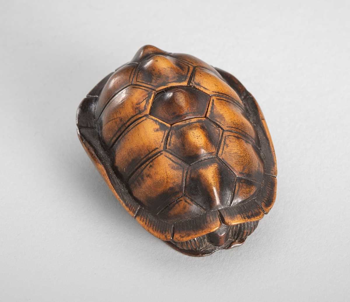 Lot 389 - MASATOMO: A WOOD NETSUKE OF A TORTOISE