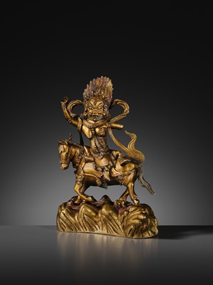 Lot 16 - A GILT BRONZE FIGURE OF SRI DEVI, PALDEN LHAMO, TIBET, 18TH CENTURY