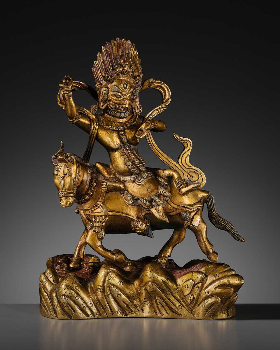 Lot 16 - A GILT BRONZE FIGURE OF SRI DEVI, PALDEN LHAMO, TIBET, 18TH CENTURY