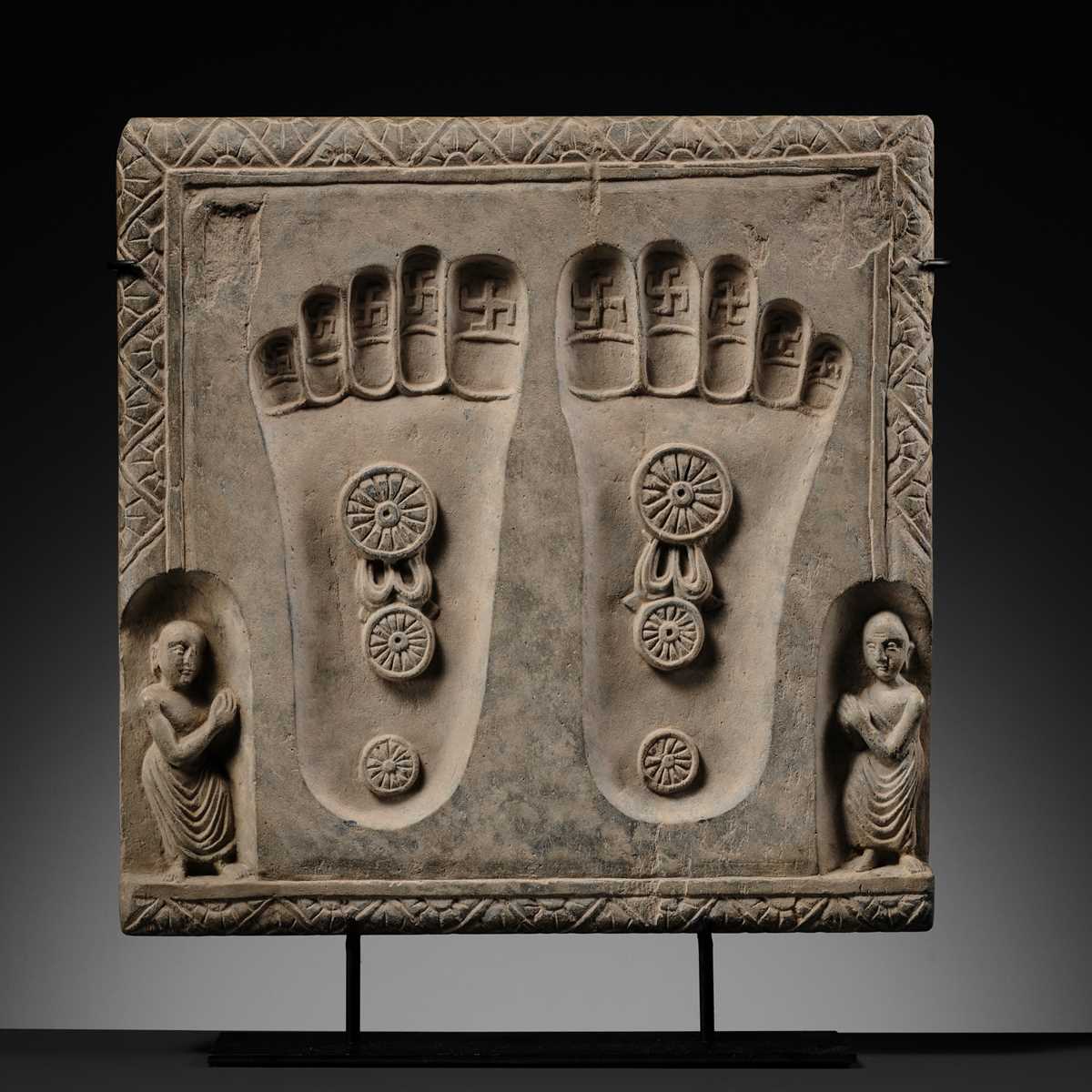 Lot 187 - A SCHIST RELIEF OF THE FOOTPRINTS OF BUDDHA,