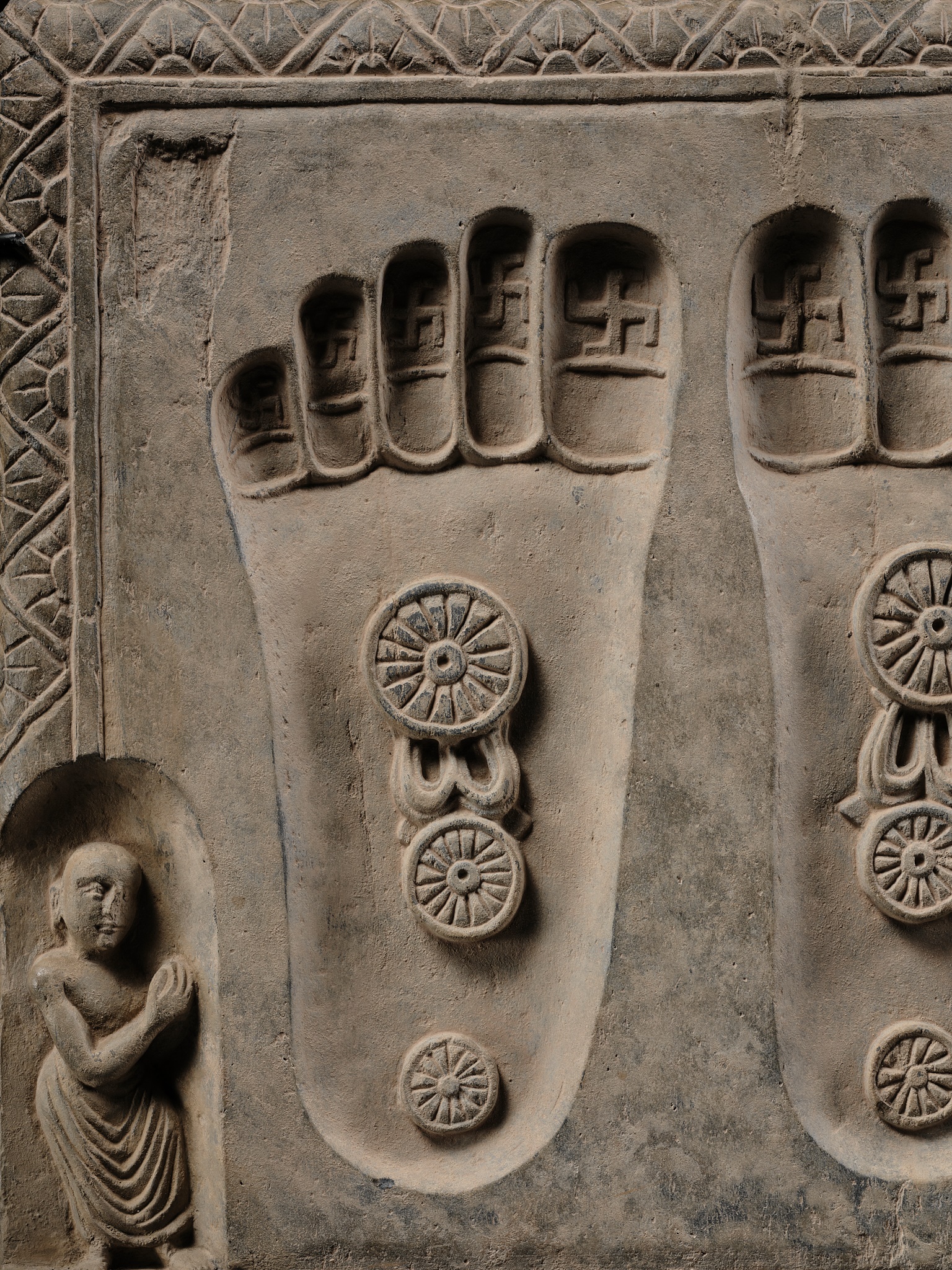 Lot 187 - A SCHIST RELIEF OF THE FOOTPRINTS OF BUDDHA,