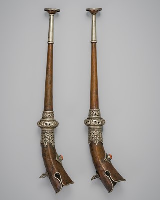 Lot 165 - A PAIR OF SILVER INLAID BRASS TRUMPETS WITH CORAL CABOCHONS, RKANGLING, TIBET, 19TH CENTURY