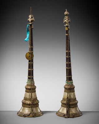 Lot 13 - A PAIR OF BRONZE REPOUSSÉ MOUNTED WOOD SHAWMS, GYALING, TIBET, 19TH CENTURY