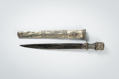 Lot 742 - A SILVERED REPOUSSÉ DAGGER AND PLAQUE, TIBET, 19TH TO EARLY 20TH CENTURY