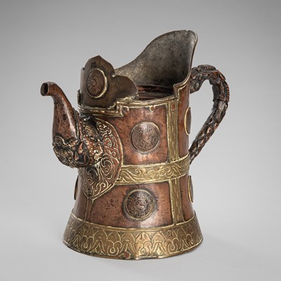 Lot 745 - A BRONZE AND COPPER RITUAL EWER, TIBET, 19TH CENTURY