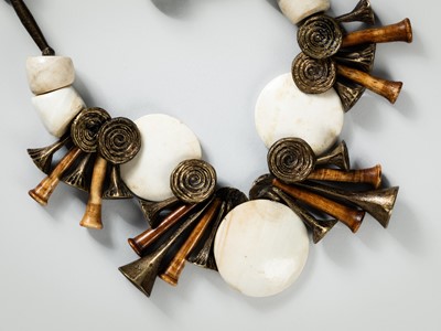 Lot 1285 - A NAGA SHELL, BRASS, AND BONE NECKLACE, c.1900s