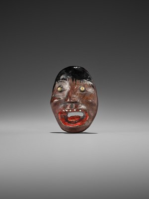 Lot 496 - AN UNUSUAL LACQUERED WOOD REVERSIBLE MASK NETSUKE OF A MONSTROUS HEAD
