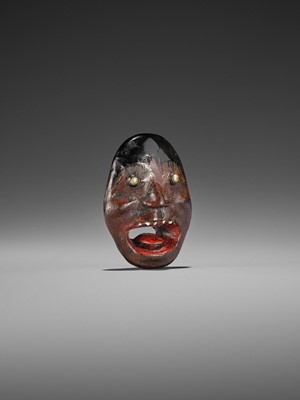 Lot 496 - AN UNUSUAL LACQUERED WOOD REVERSIBLE MASK NETSUKE OF A MONSTROUS HEAD