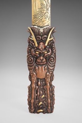 Lot 51 - A COPPER AND BRASS ‘KIRIN AND BIRDS’ PAGE TURNER