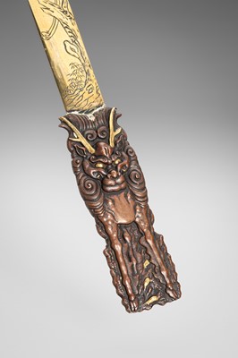Lot 51 - A COPPER AND BRASS ‘KIRIN AND BIRDS’ PAGE TURNER