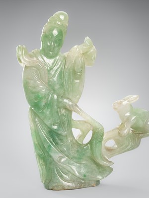 Lot 976 - A MOTTLED GREEN JADEITE FIGURE OF GUANYIN, c. 1900s