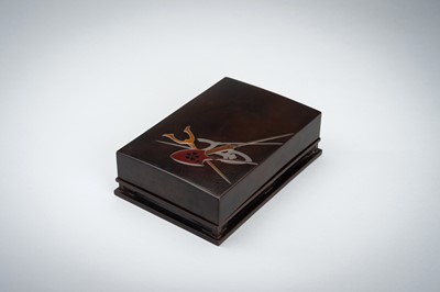 Lot 155 - A LACQUER BOX AND COVER DEPICTING WEAPONS
