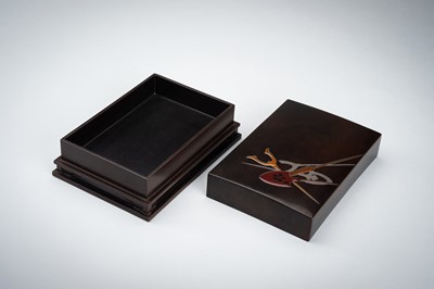 Lot 155 - A LACQUER BOX AND COVER DEPICTING WEAPONS