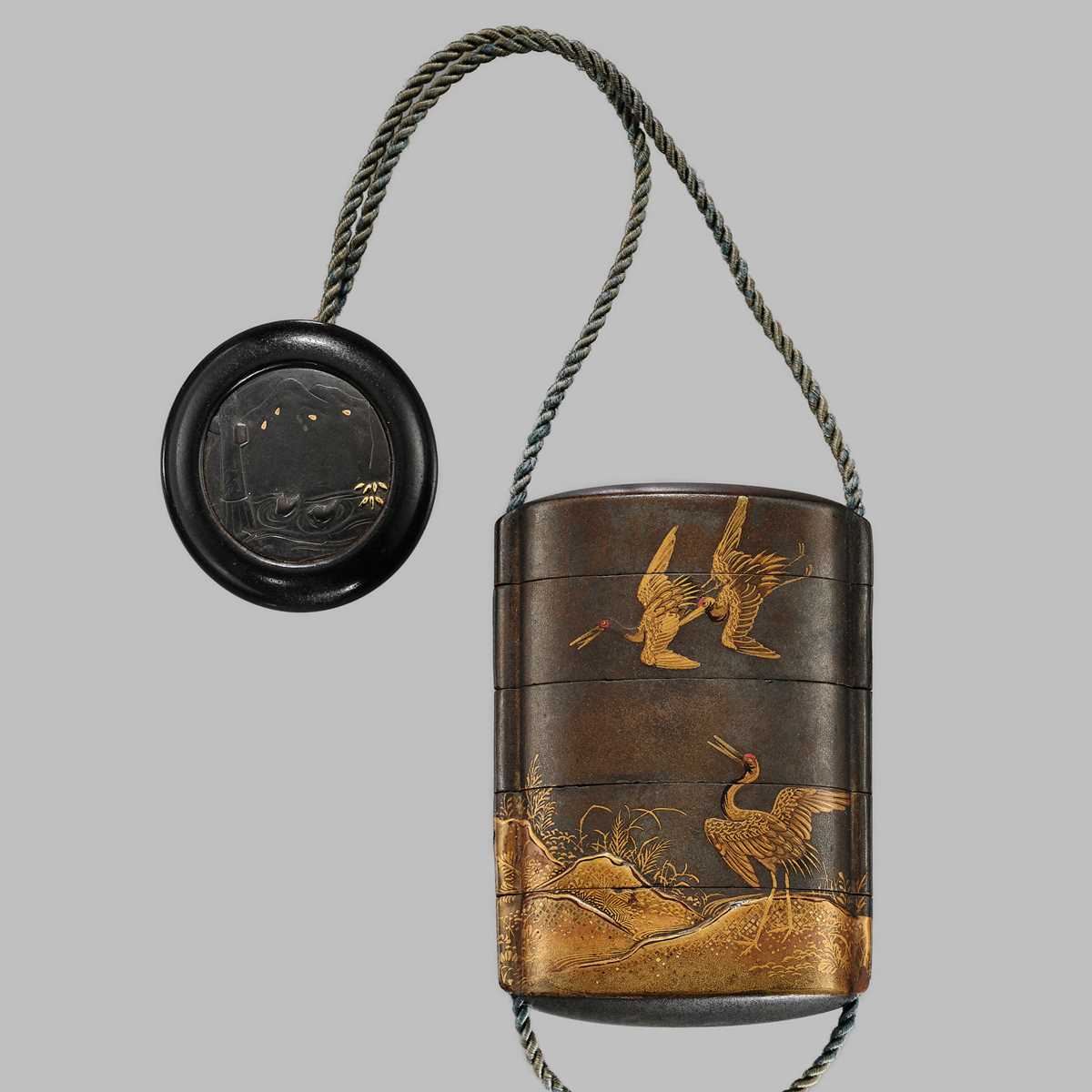 Lot 1405 - A FOUR-CASE SILVER LACQUER INRO WITH CRANES