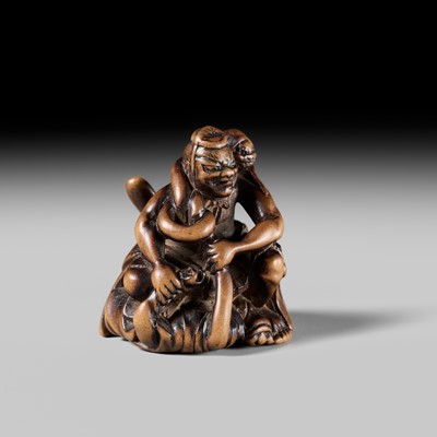 Lot 440 - KOKUZAN: A RARE WOOD NETSUKE DEPICTING A WARRIOR STRUGGLING WITH A YOKAI