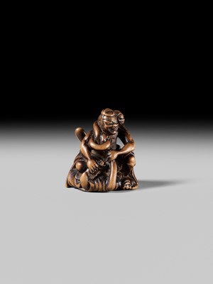 Lot 440 - KOKUZAN: A RARE WOOD NETSUKE DEPICTING A WARRIOR STRUGGLING WITH A YOKAI