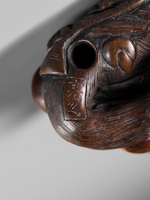 SUKEYUKI: A FINE WOOD NETSUKE OF A PERFORMING MONKEY