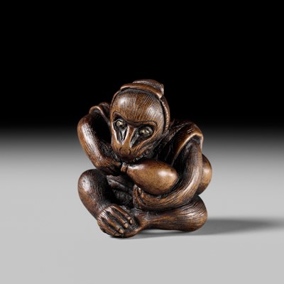 SUKEYUKI: A FINE WOOD NETSUKE OF A PERFORMING MONKEY